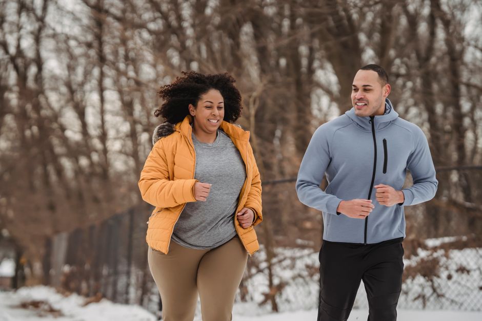 Person jogging outdoors as part of a weight loss routine