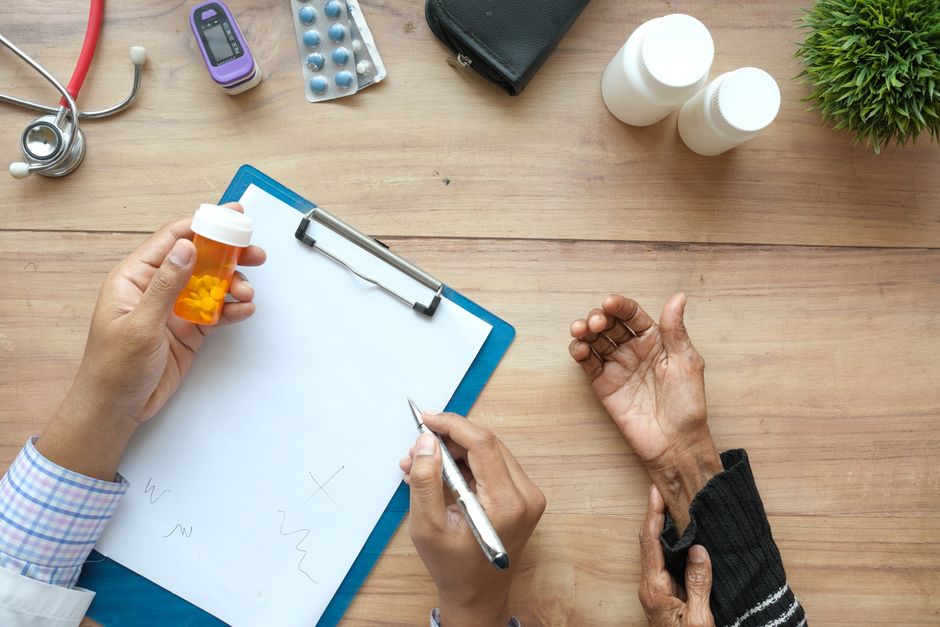 Doctor reviewing blood pressure medication after weight loss surgery