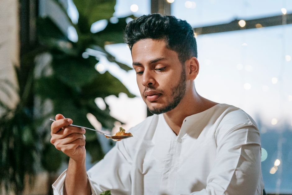 Patient eating a soft food meal during fundoplication recovery