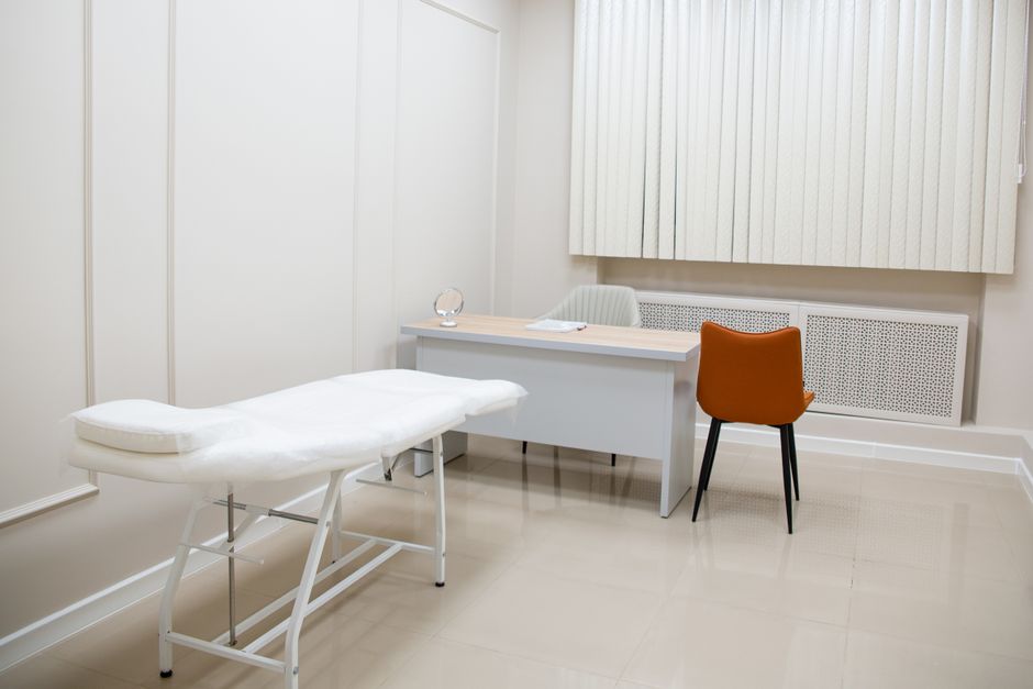Doctor with medical equipment during a consultation room visit