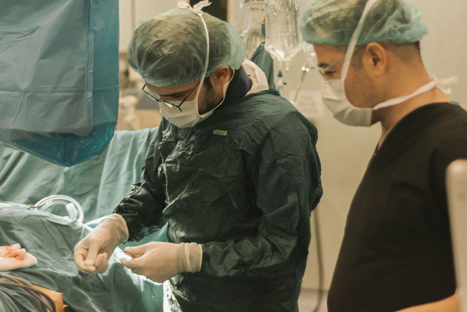 Surgeon discussing a medical diagram with a patient during consultation