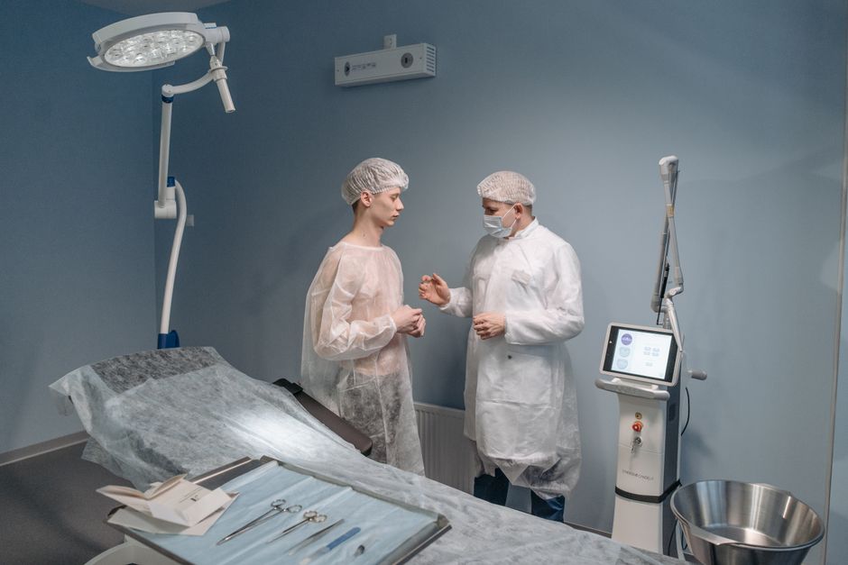 Surgeon explaining a surgery diagram to a patient