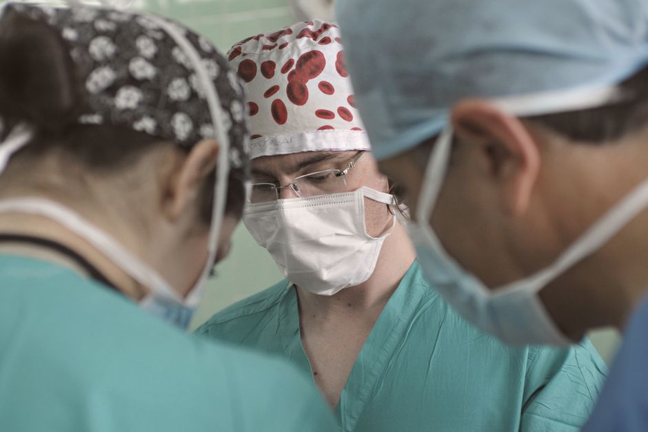 Surgeon and team in an operating room preparing for surgery