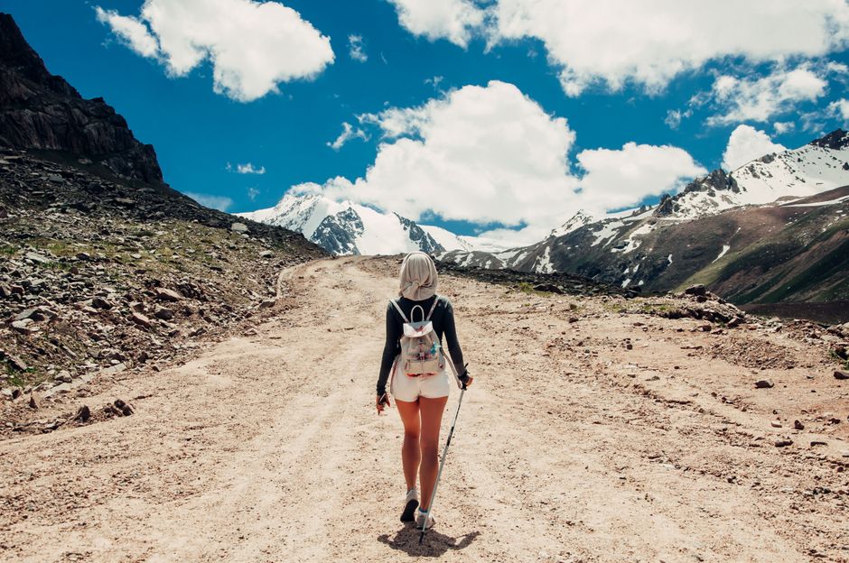 Person hiking outdoors as part of an active healthy lifestyle