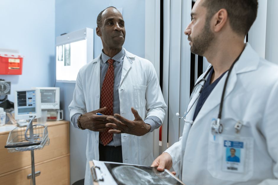 Doctor discussing pros and cons of a treatment option with a patient