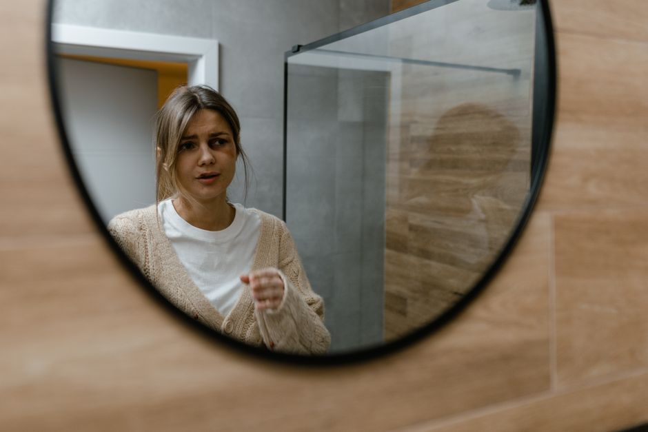 Woman reflecting on her identity after major weight loss
